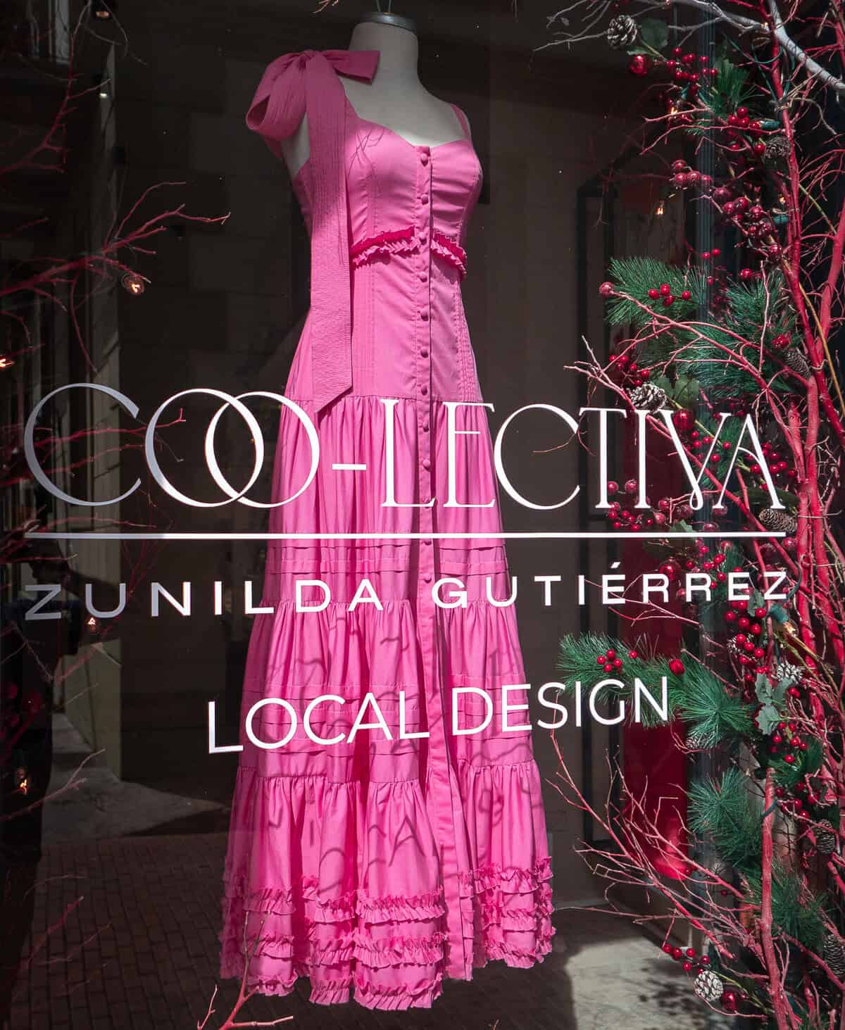 Pink handcrafted dress by local designer Zunilda Gutiérrez displayed in a gallery window on Calle 10 in Casco Viejo, Panama