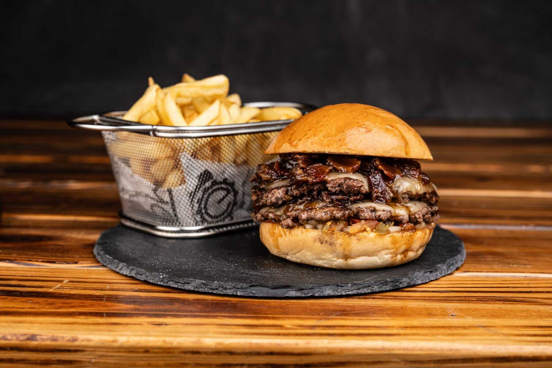 House burger served with fries at Element Bar Casco Viejo