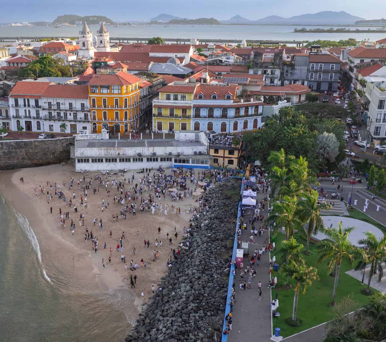 Crowds gathered on Playita Las Garzas beach during Casco Peatonal 4th Sunday in Casco Viejo, Panama City