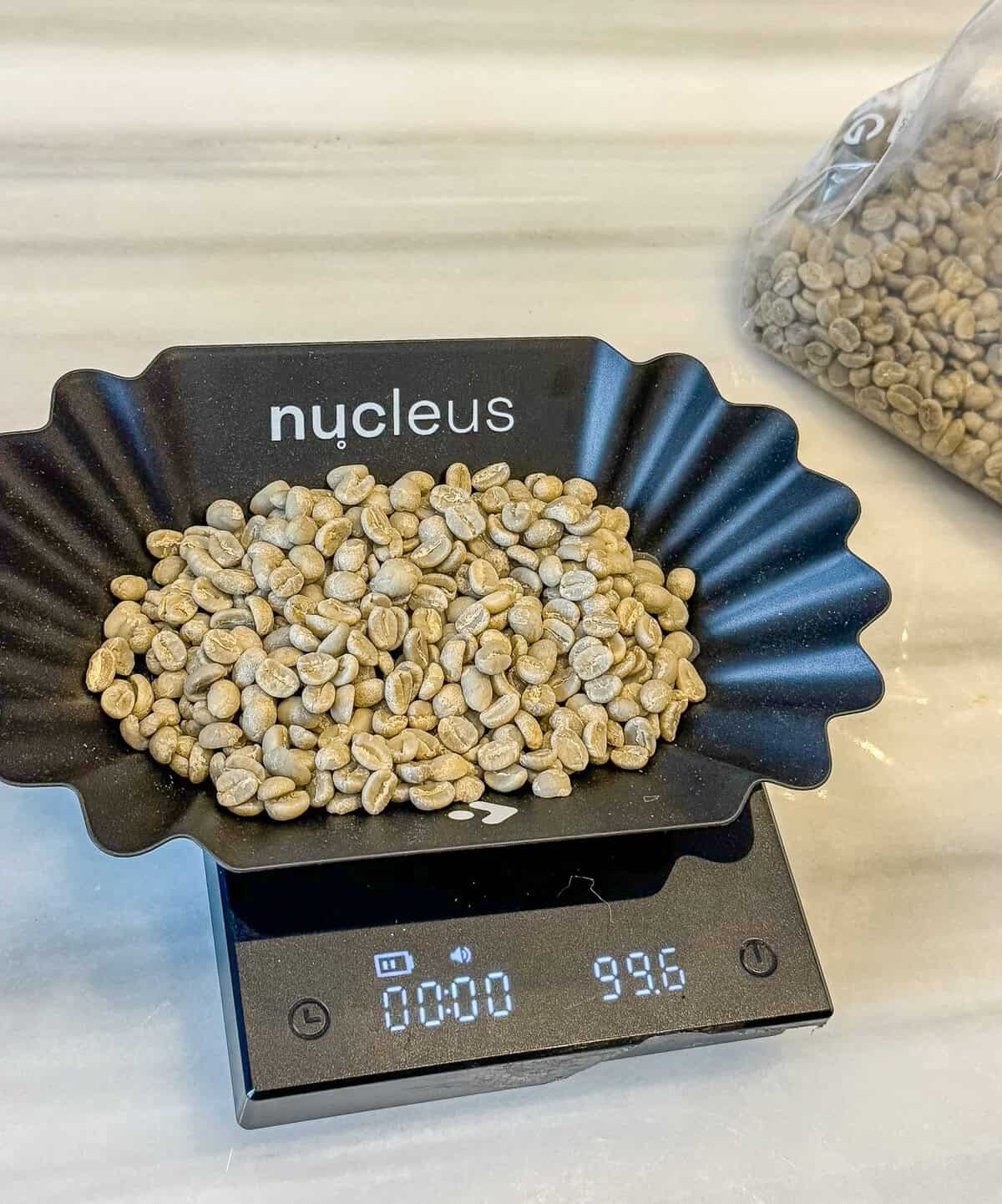 Coffees of Panama green coffee beans being weighed before roasting using a precision scale