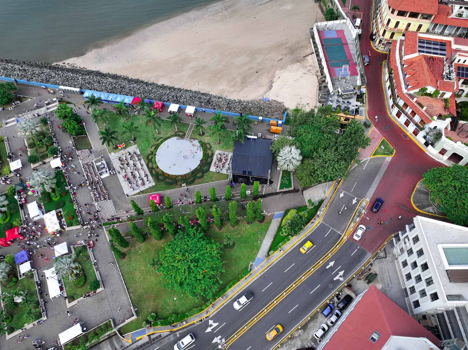 Drone aerial image of Cinta Costera 2 in Panama City showing the waterfront walking and cycling lanes, green recreational areas, Avenida Balboa skyline, and close proximity to Casco Viejo hotels. This sunrise Panama City walk near Casco Viejo offers structure, safety, and clear city orientation