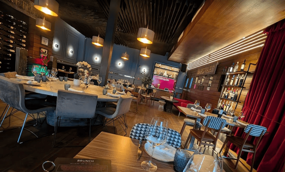 El Enemigo restaurant at Hotel San Felipe in Casco Viejo Panama with elegant indoor dining, warm lighting, and wine display