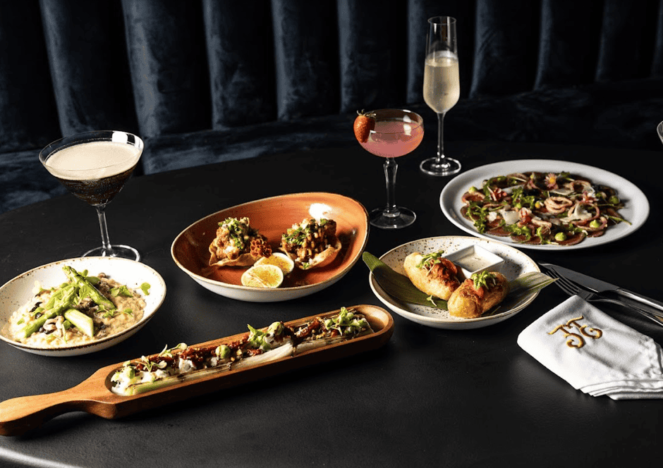 El Enemigo restaurant dishes at Hotel San Felipe in Casco Viejo Panama with cocktails and plated gourmet cuisine