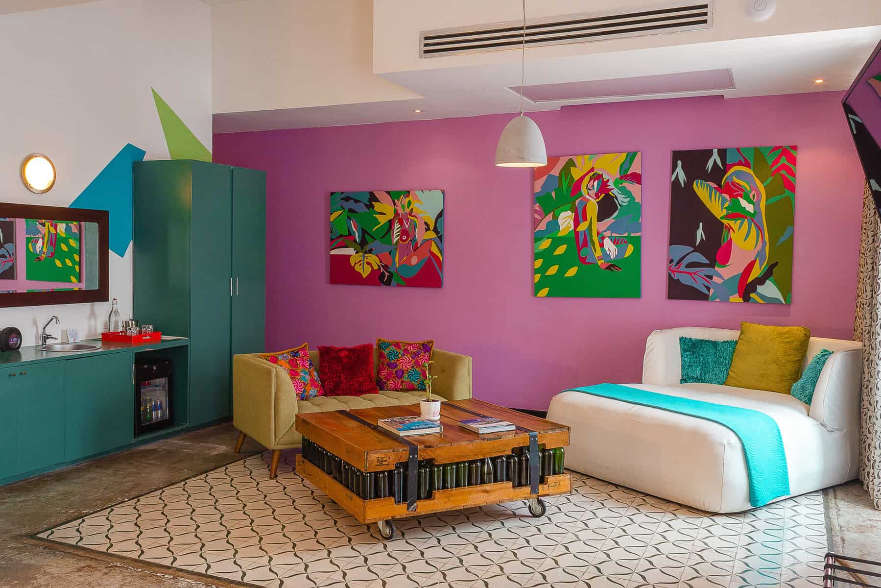 Colorful boutique hotel room at Tantalo Hotel in Casco Viejo Panama with modern art and lounge seating