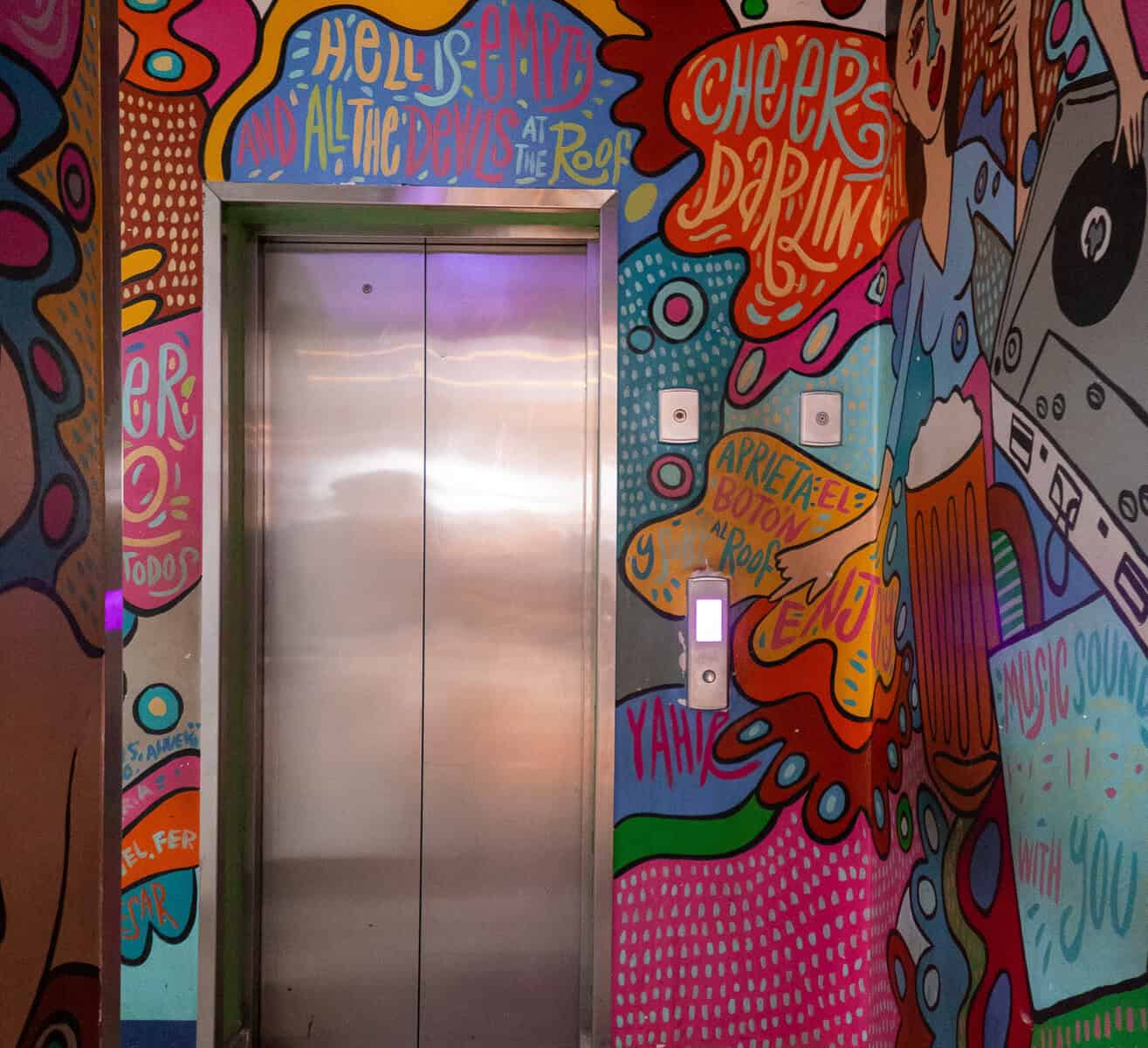 This is where it shifts — the elevator ride that takes you from the restaurant to the rooftop experience at Tántalo