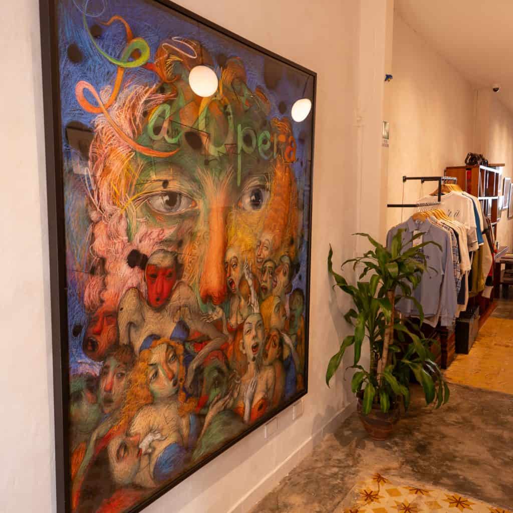 Brooke Alfaro painting inside Olympia Coffee Studio Casco Viejo Panama