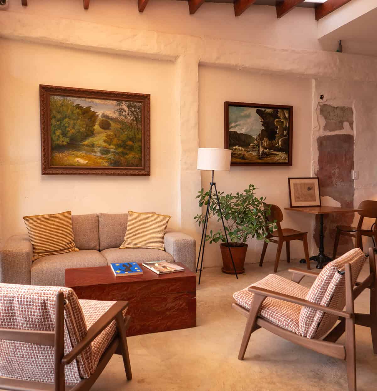 Lounge seating area inside Olympia Coffee Studio Casco Viejo Panama with sofas and chairs