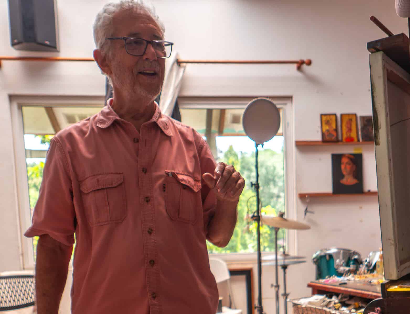 Brooke Alfaro inside his studio in Panama speaking beside his work