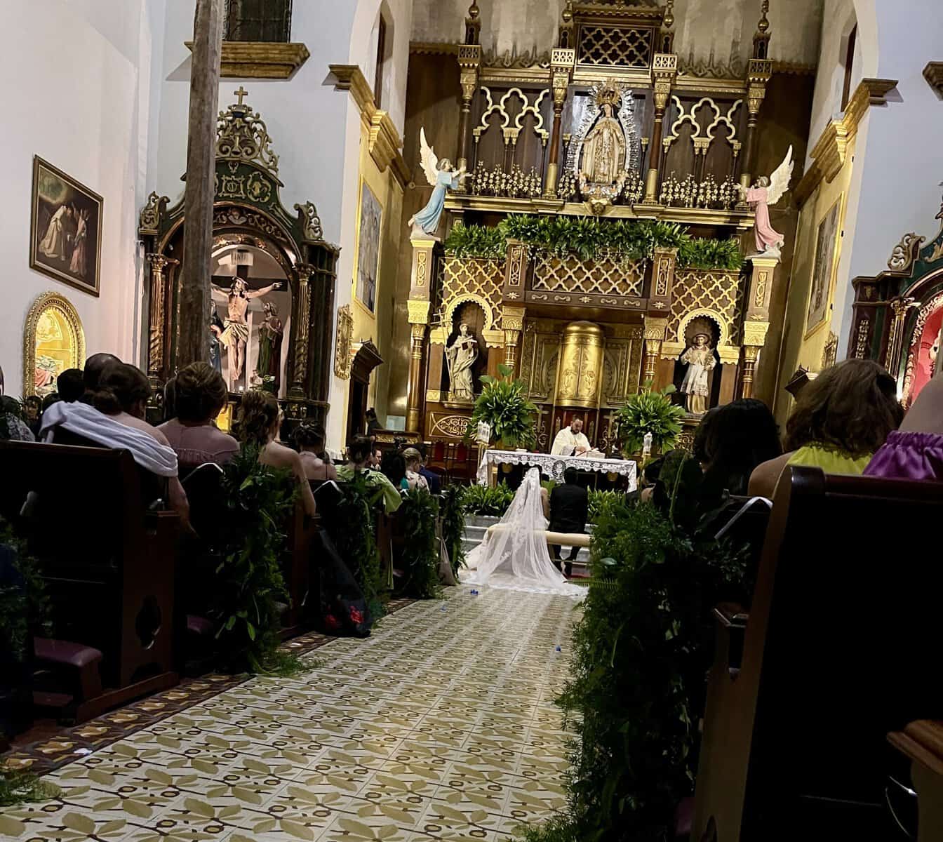 Wedding ceremony taking place inside La Merced Church in Casco Viejo, Panama City.