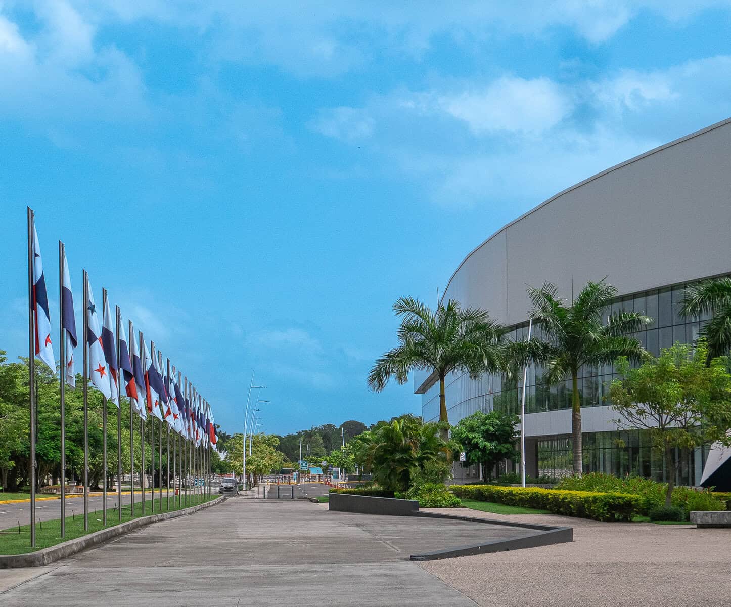 Panama Convention Center entrance on the Amador Causeway in Panama City with international flags.