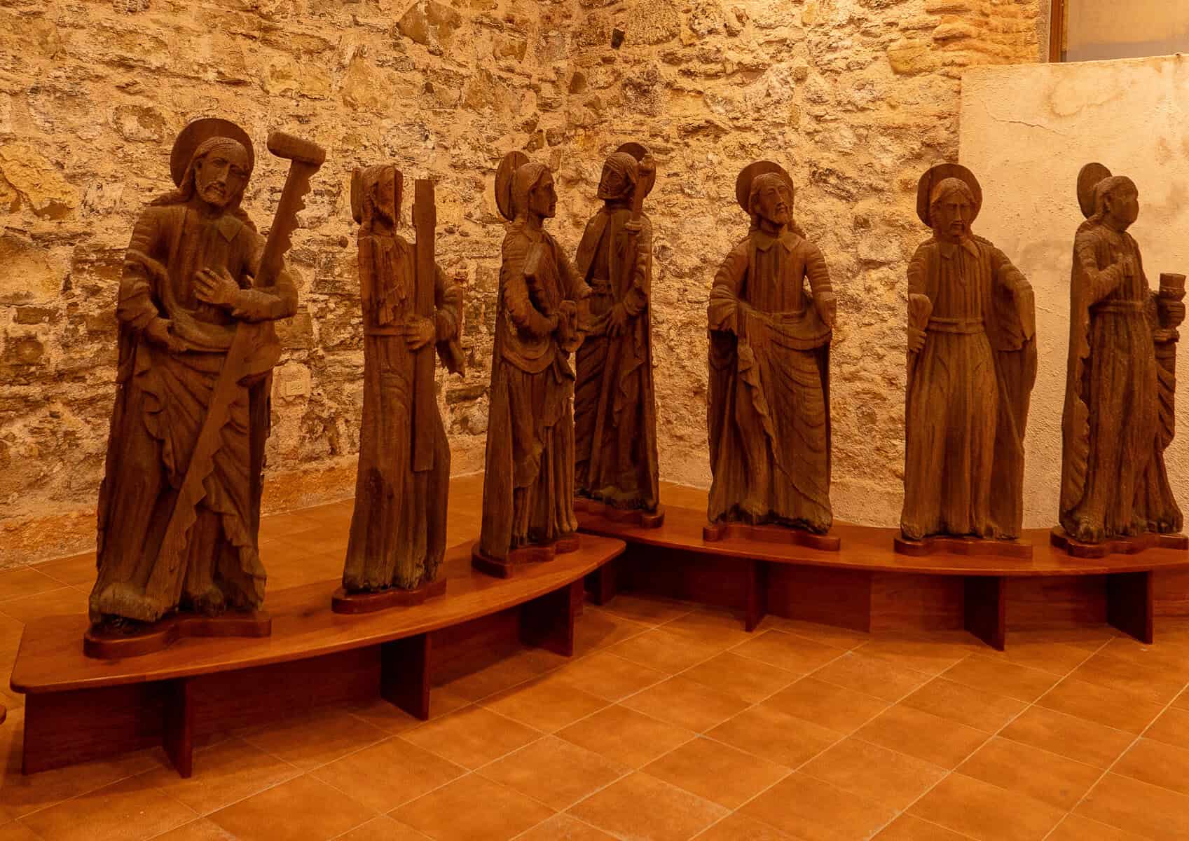 Historic carved wooden religious statues displayed inside the Church of the Golden Altar (Iglesia de San José) in Casco Viejo, Panama City.