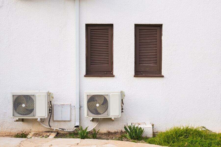 Ductless mini-split air conditioner with indoor and outdoor units for zoned cooling.