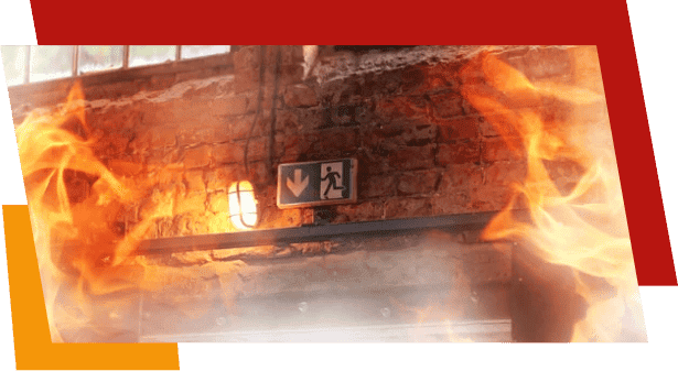 Emergency exit sign above doorway engulfed in flames