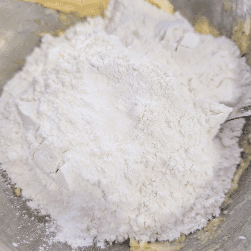 Flour and baking ingredients for blueberry lemon crumble squares.