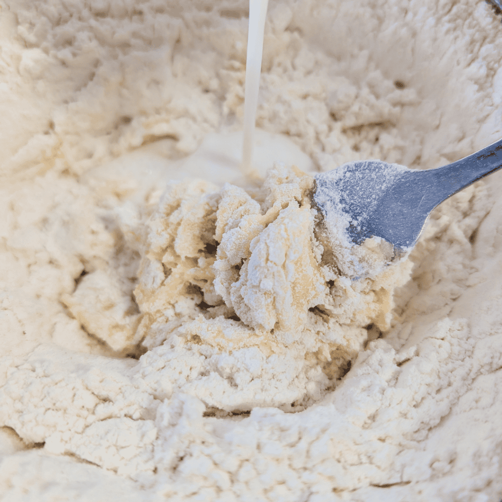 Blueberry lemon crumble mixture being prepared for dessert baking.