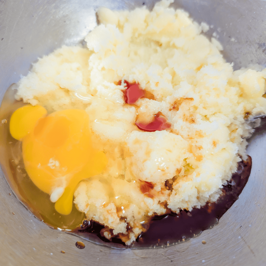 Ingredients for blueberry lemon crumble squares in a mixing bowl.