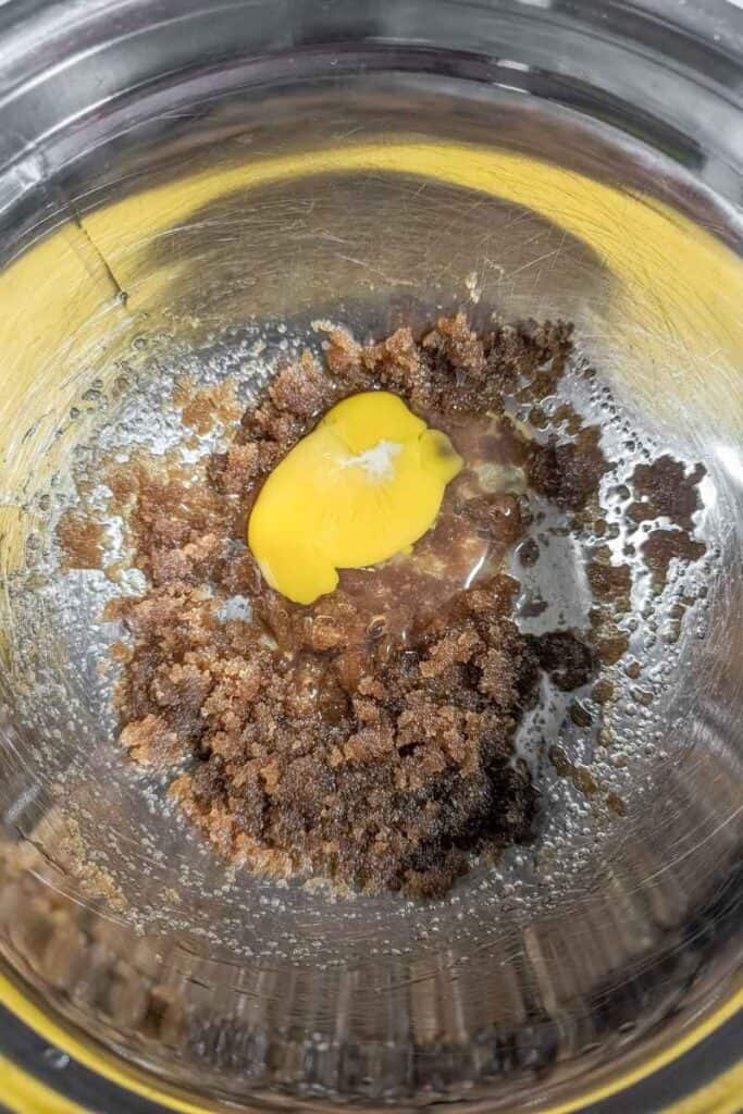 adding egg and oil to brown sugar