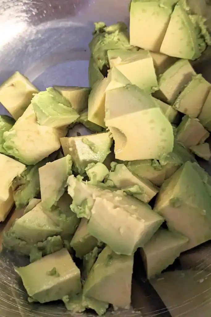 diced avocado in salad bowl