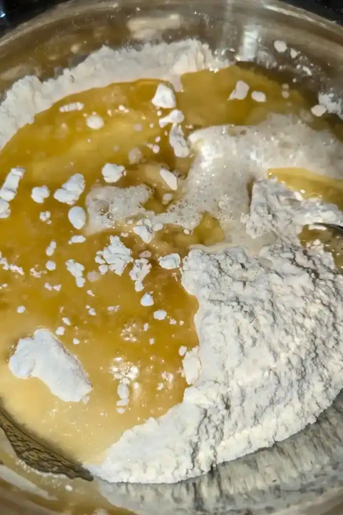 adding the neutral oil to the dry ingredients