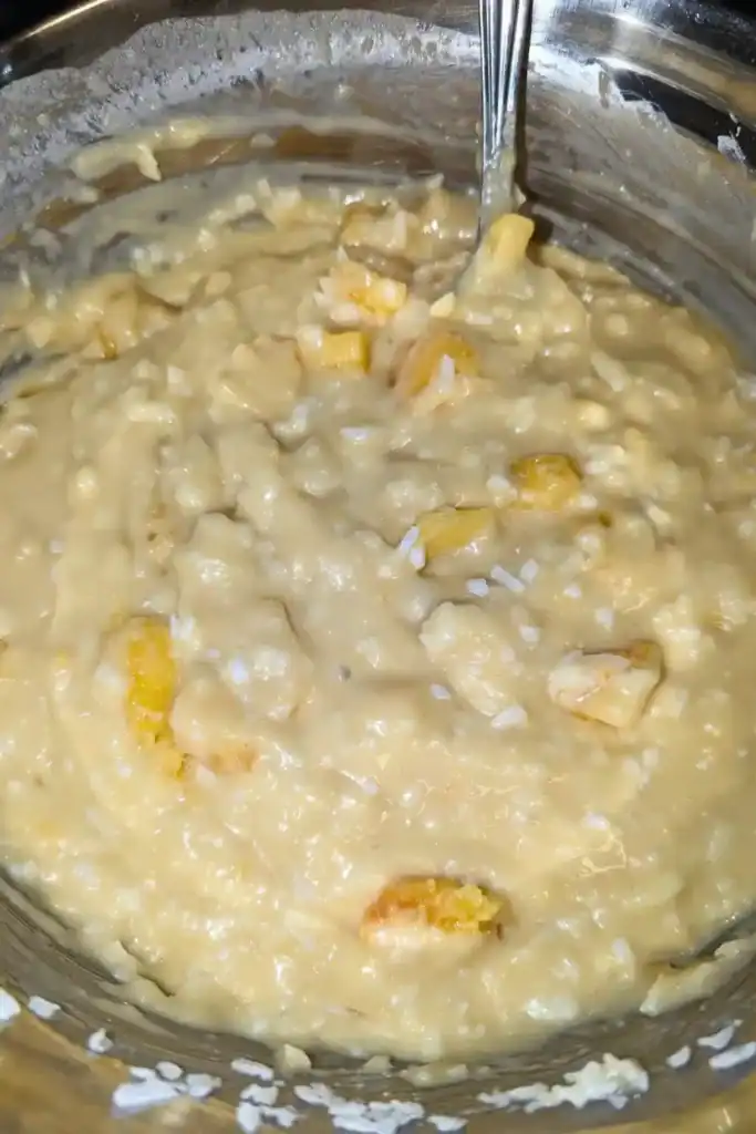 the finished batter with peaches and coconut folded in