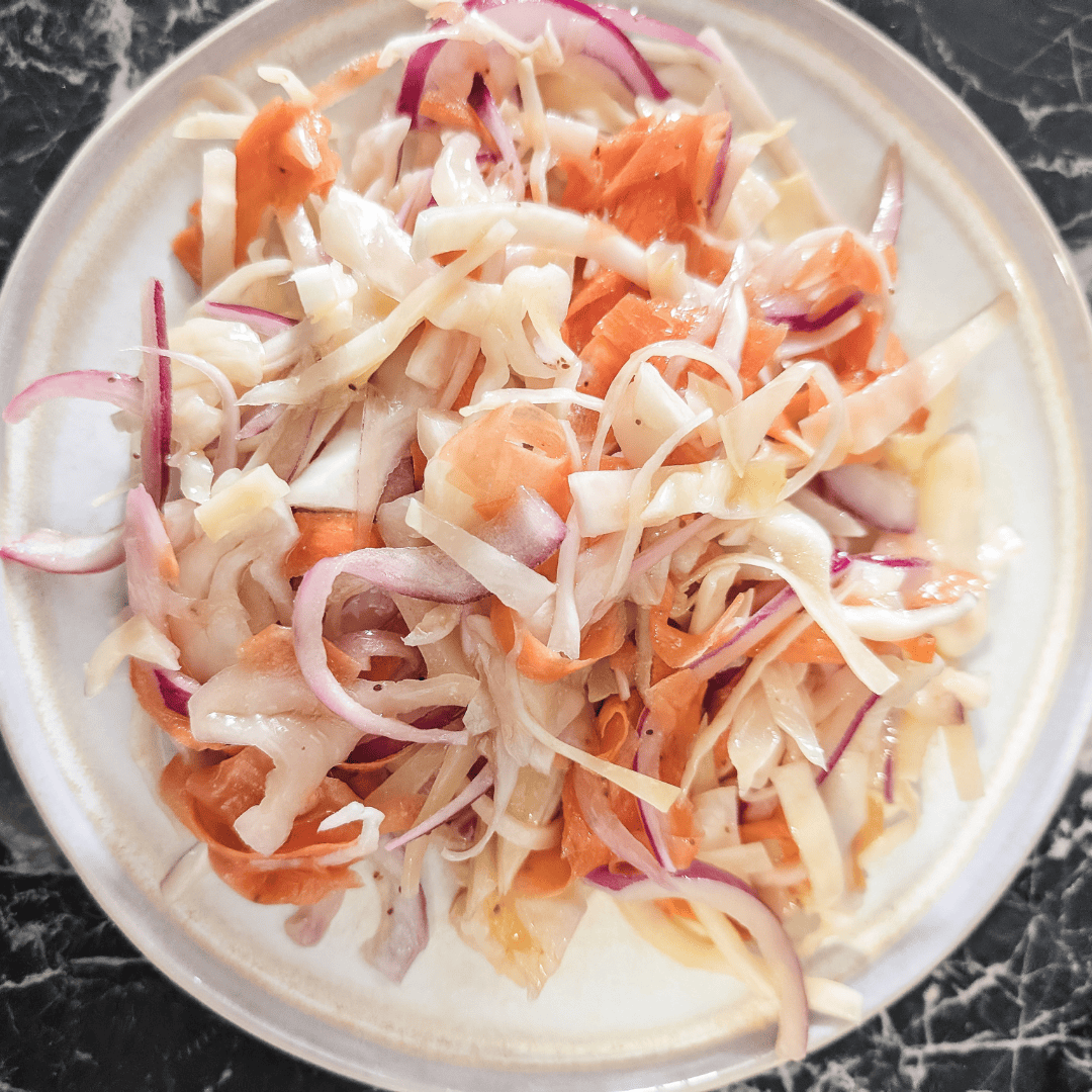 Fresh homemade coleslaw with no mayo, perfect for healthy salads and side dishes.