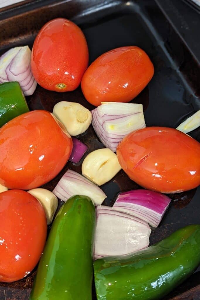 vegetables rolled to coat in olive oil