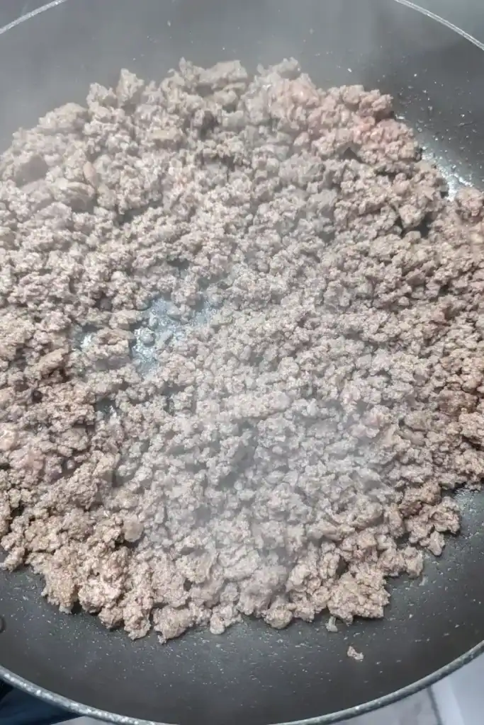 browned ground beef in fry pan