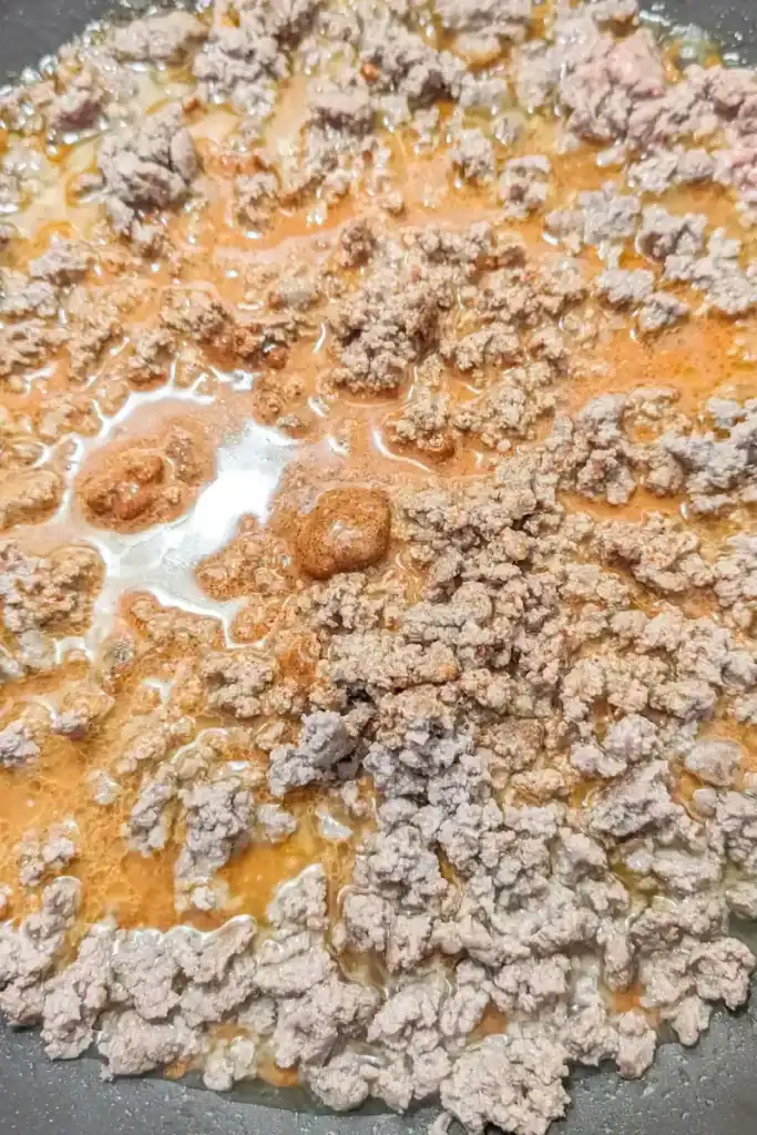 adding old el paso taco seasoning to the ground beef