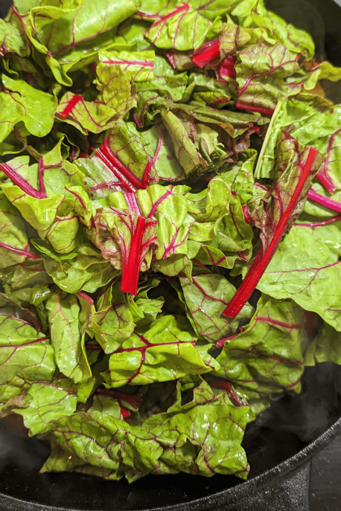 add Swiss chard to cast iron skillet
