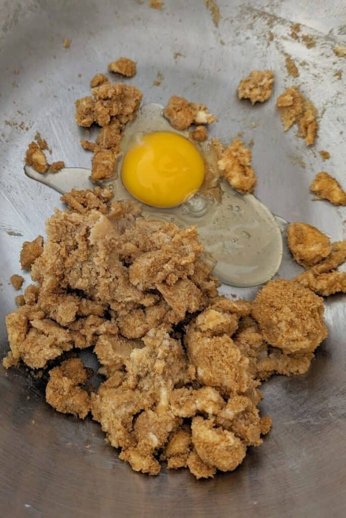 adding egg to creamed butter and sugar