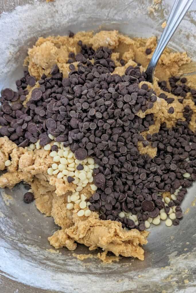 adding mini semisweet and dark chocolate chips to cookie dough