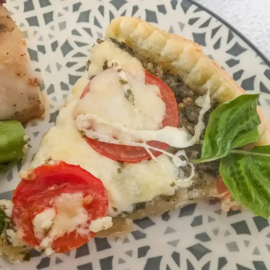 recipe card image of a slice of tomato tart