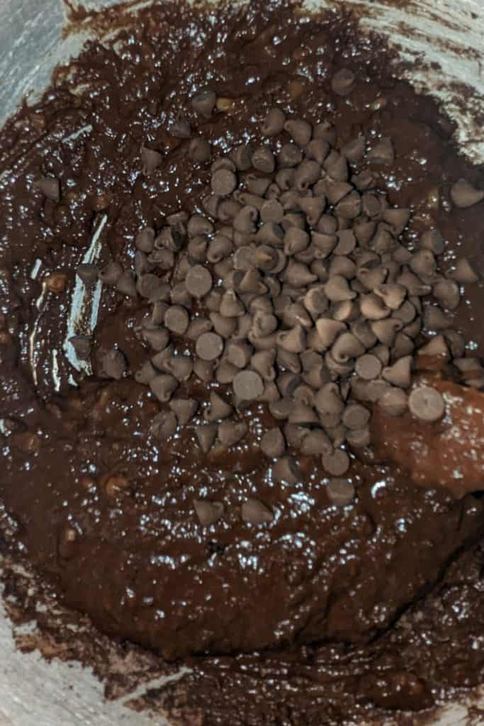 add chocolate chips to eggless banana chocolate brownie batter