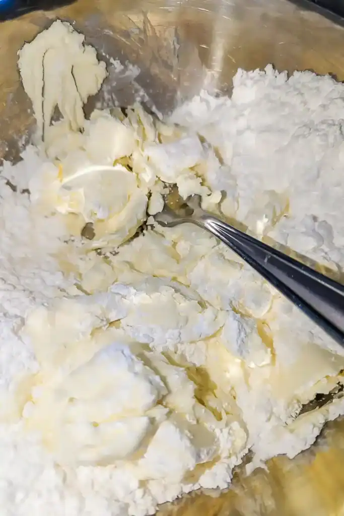 cutting in the butter to dry ingredients in stainless steel bowl