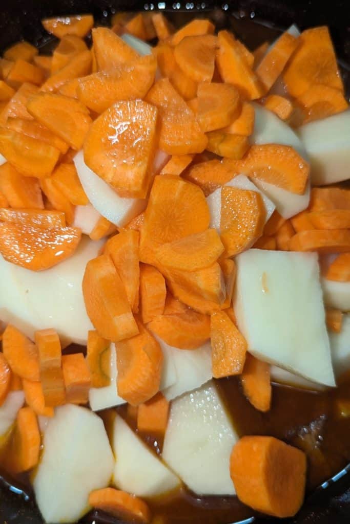 add potato and carrot to lamb tagine