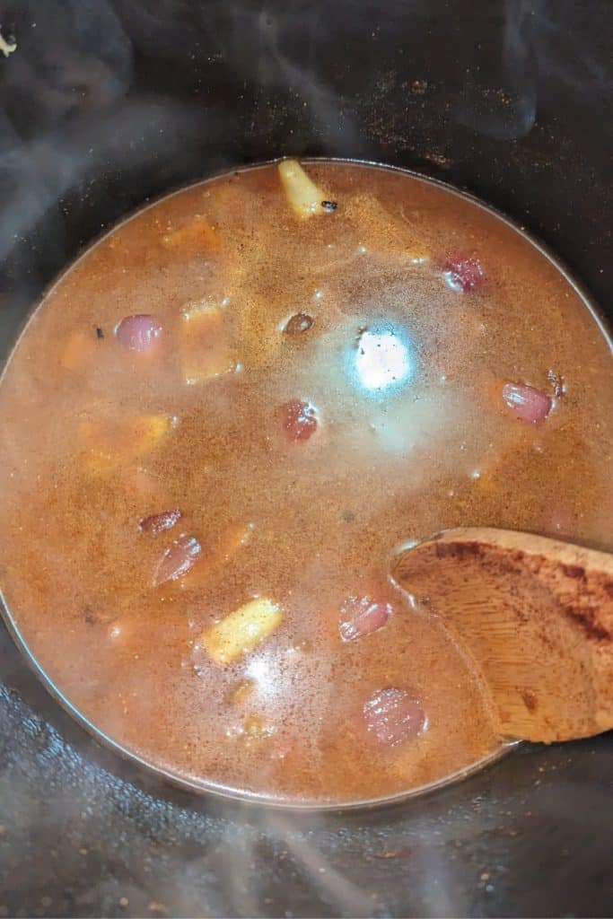 add stock to the spiced mix