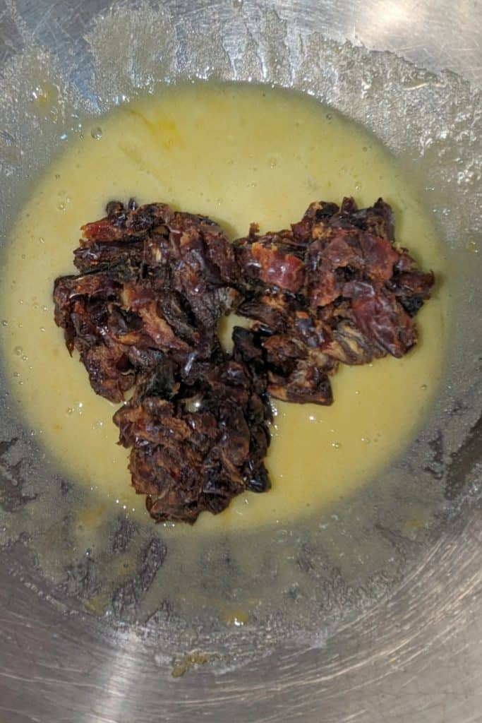 adding dates to egg sugar mixture