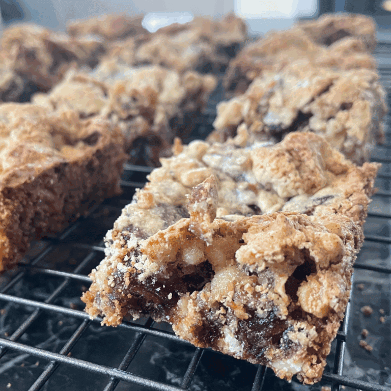 Delicious homemade cookies with chocolate chips on cooling rack, perfect for baking lovers.