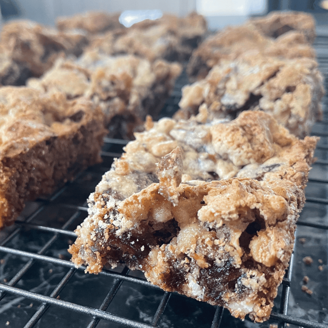 Delicious homemade cookies with chocolate chips on cooling rack, perfect for baking lovers.
