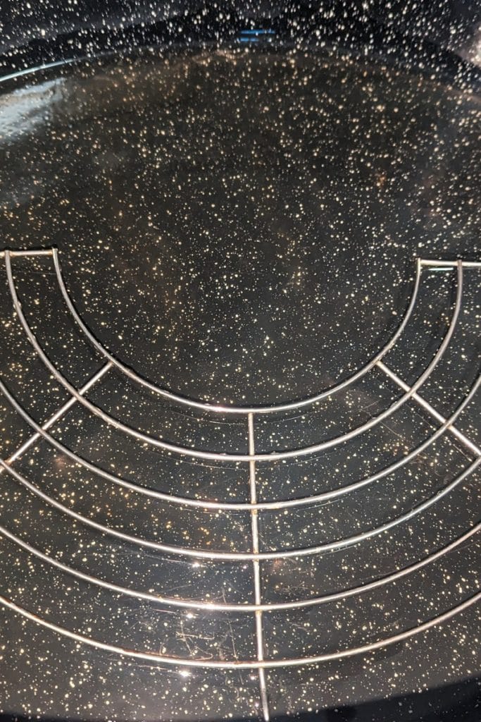 rack in roasting pan with stock added