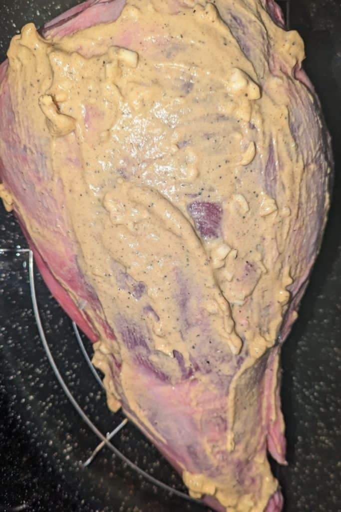 slathered leg of lamb with Dijon garlic coating