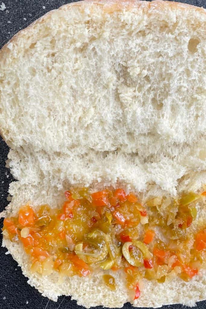 adding Muffeletta spread to Scotch Bap
