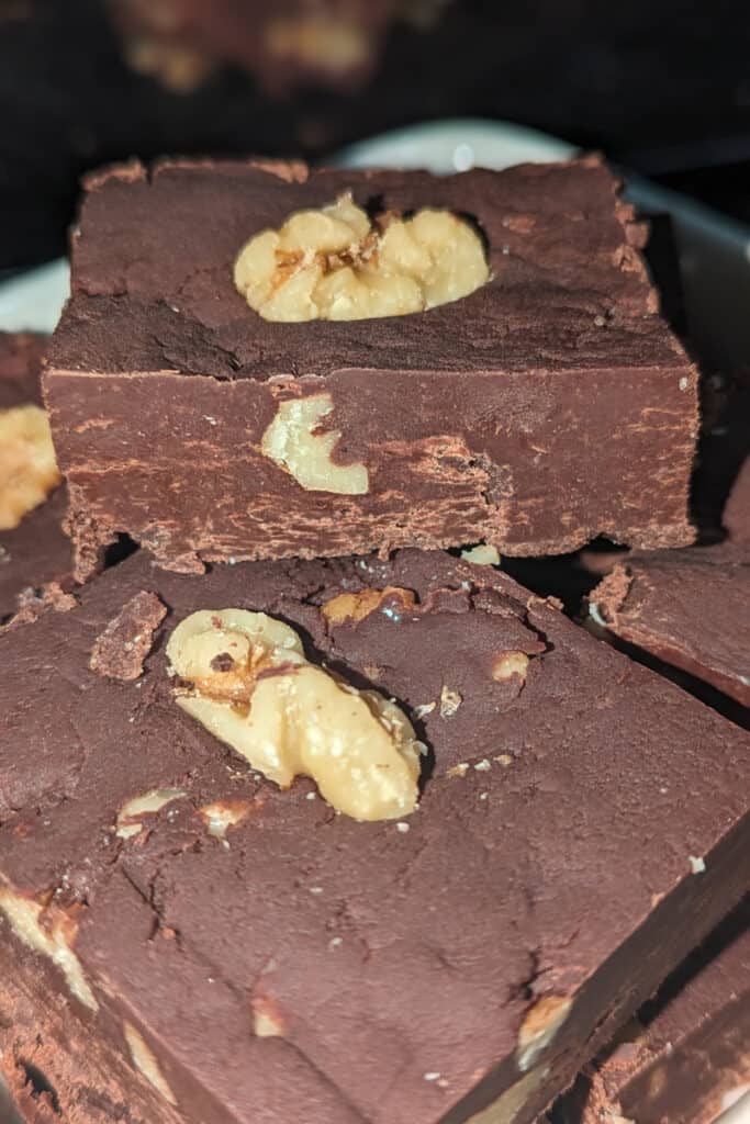 cut harden semi-sweet chocolate walnut fudge into pieces (3)