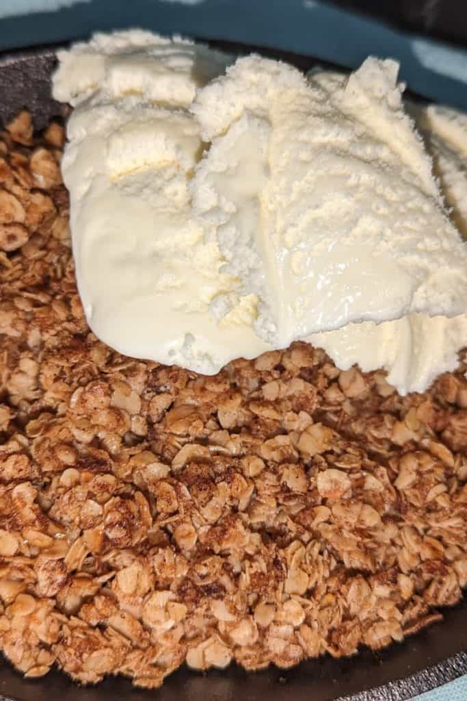 serve peach crisp with a scoop of ice cream