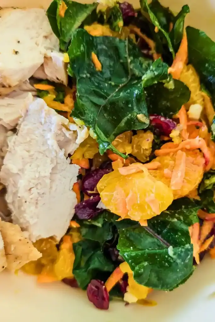 close up of grilled chicken kale salad