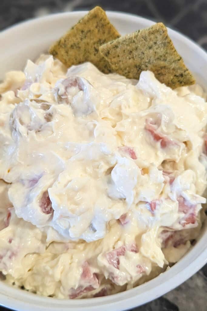 classic cream cheese holiday dip with olives and pepperoni