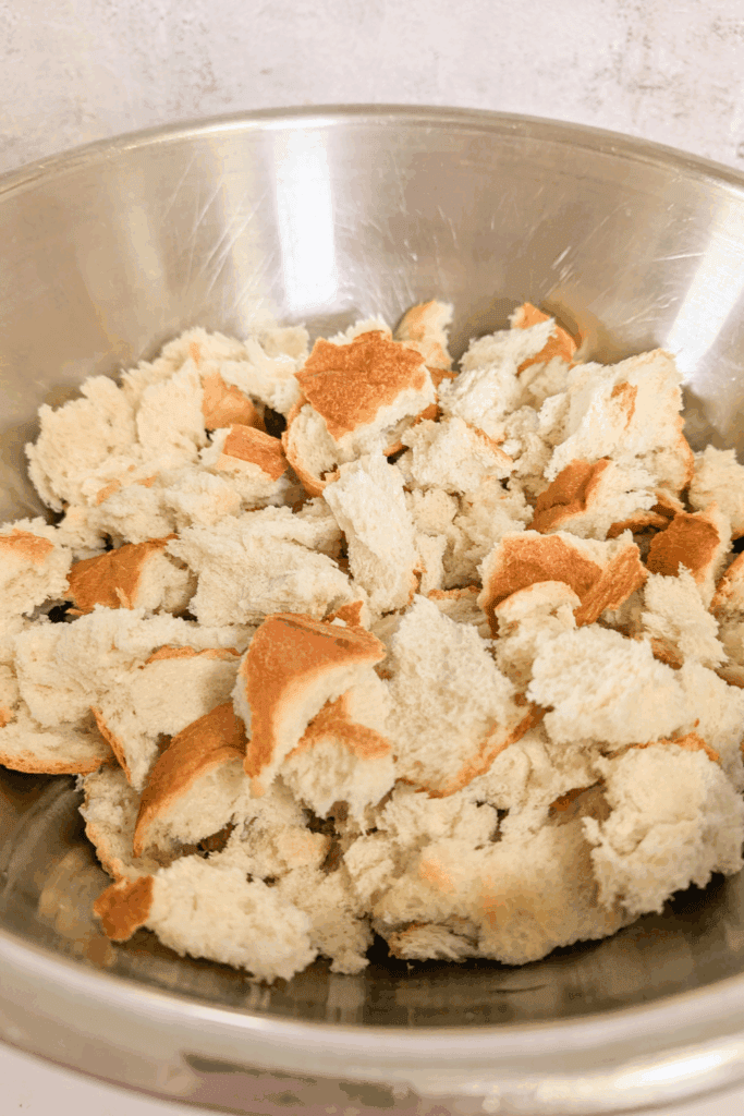 Crushed bread in a mixing bowl for cooking recipes.