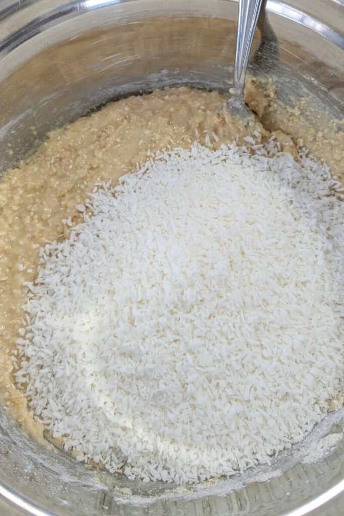adding shredded coconut to cookie batter