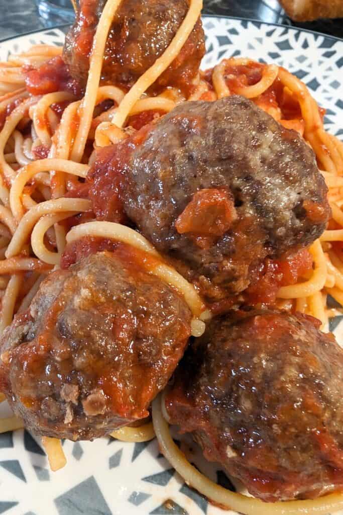 baked meatballs in tomato sauce with spaghetti