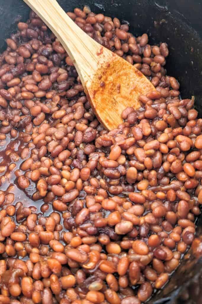 stirring them as they cook in slow cooker